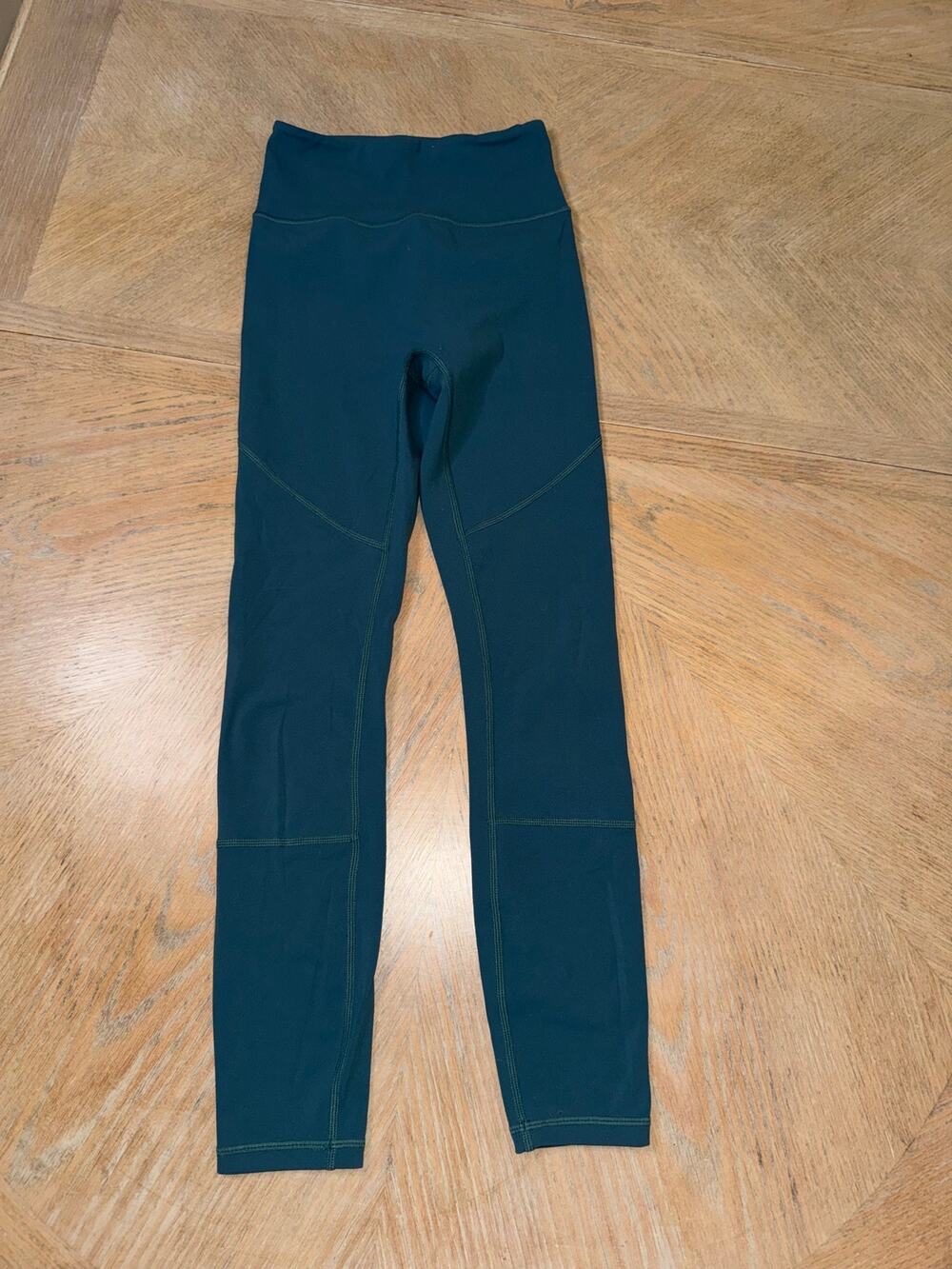 ACTA Wear high-waisted teal athletic leggings featuring flatlock curved seams xs